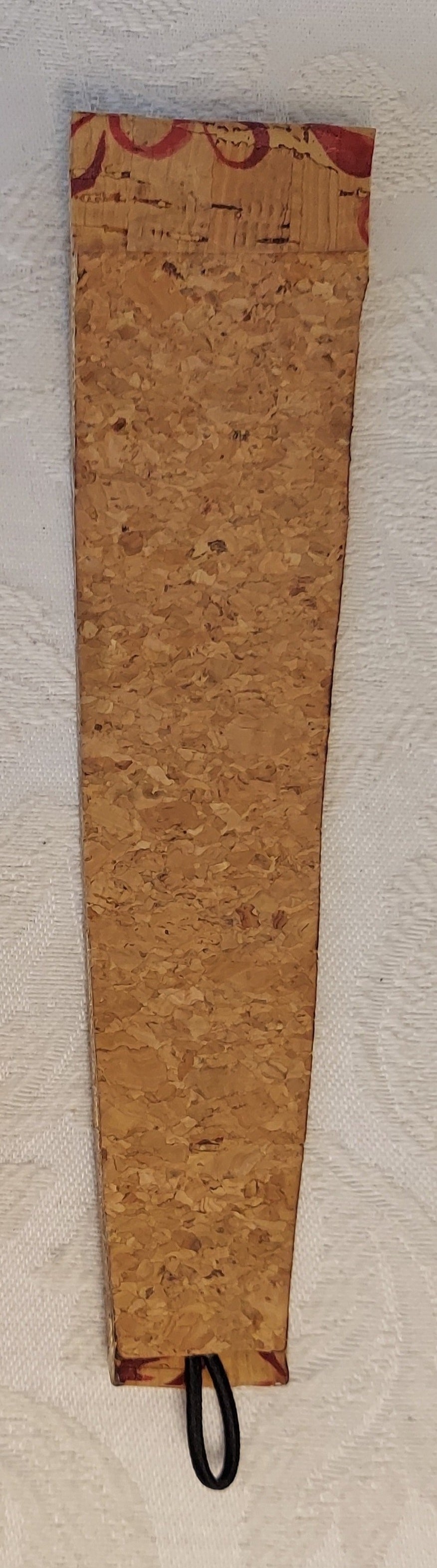 Back view of the eco-friendly cork bracelet, highlighting the natural cork texture and durable elastic loop closure.