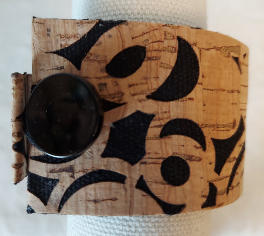 Abstract Circle Cork Bracelet with a unique black circular design on eco-friendly cork material, featuring a stylish button clasp.